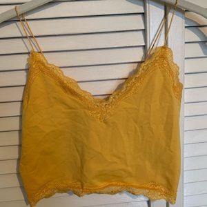 Yellow cropped lace tank top.